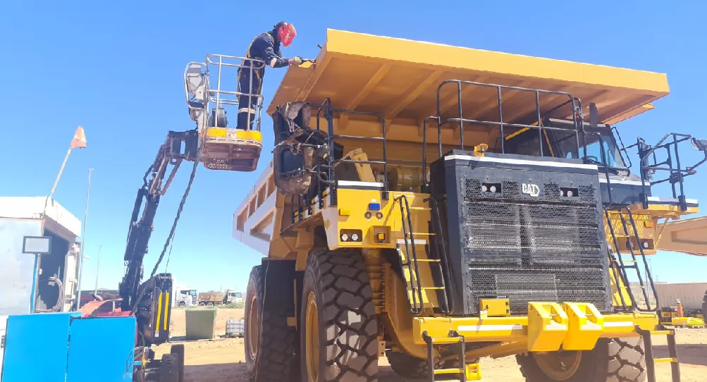 CBU Engineering technician working at height on a CAT 777 mining truck