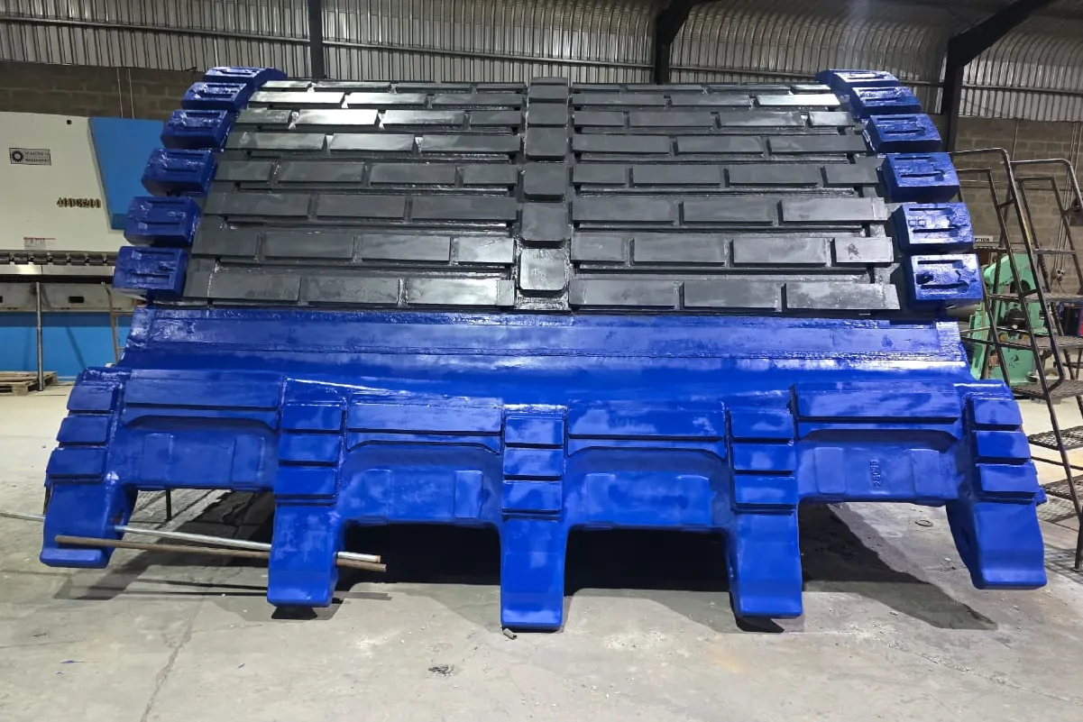 Large blue mining bucket fitted with heavy wear protection