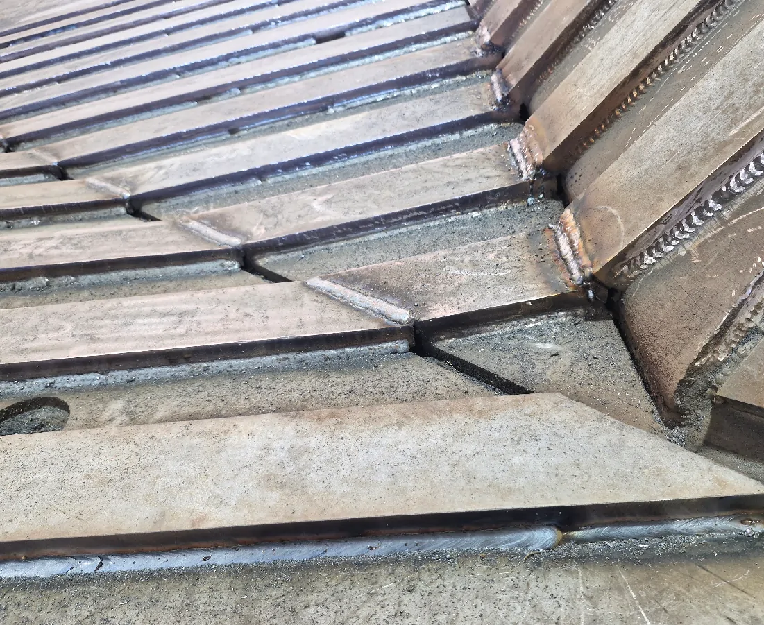 Detailed wear protection steel arrangement on heavy equipment